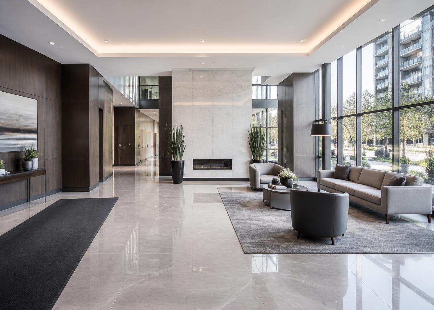 Upscale condominium lobby with polished floors and modern seating